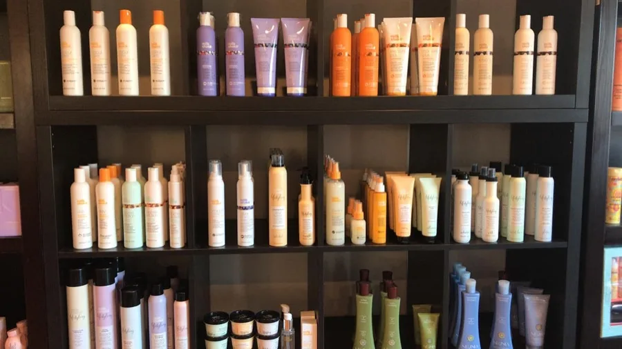 Retail shelf of milk_shake haircare products at Salon Tres Chic