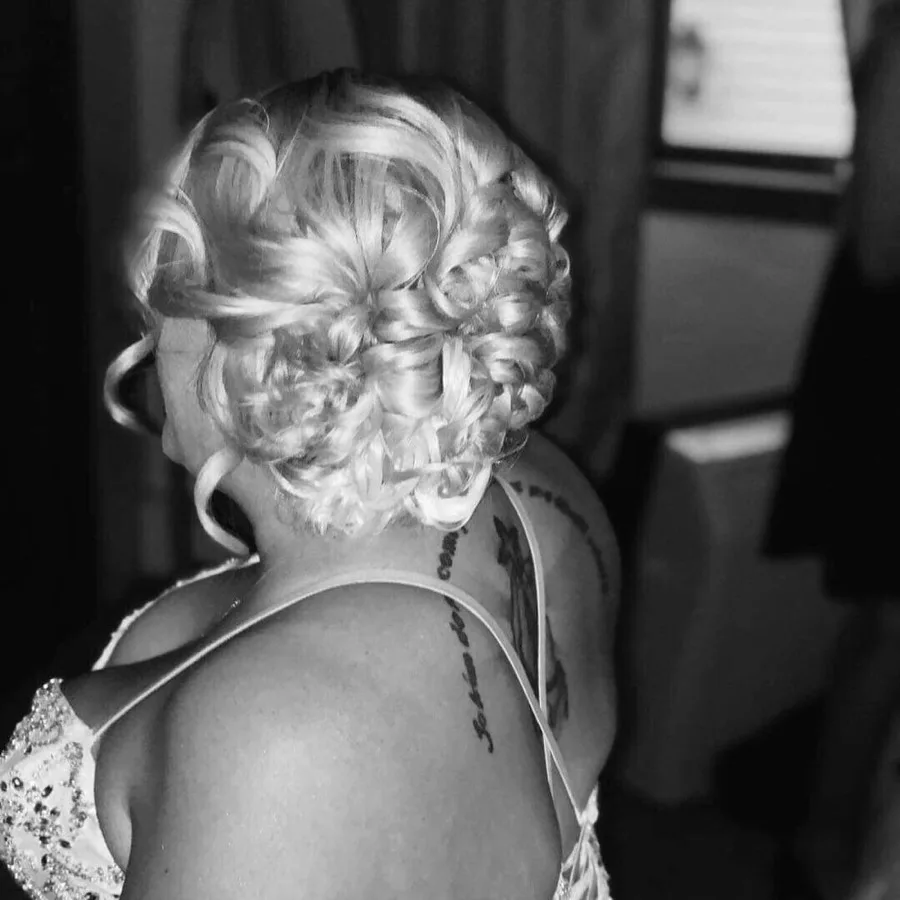 Elegant curled updo styled at Salon Tres Chic